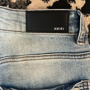AMIRI Ripped Distressed Denim Shorts with Logo - Light Blue